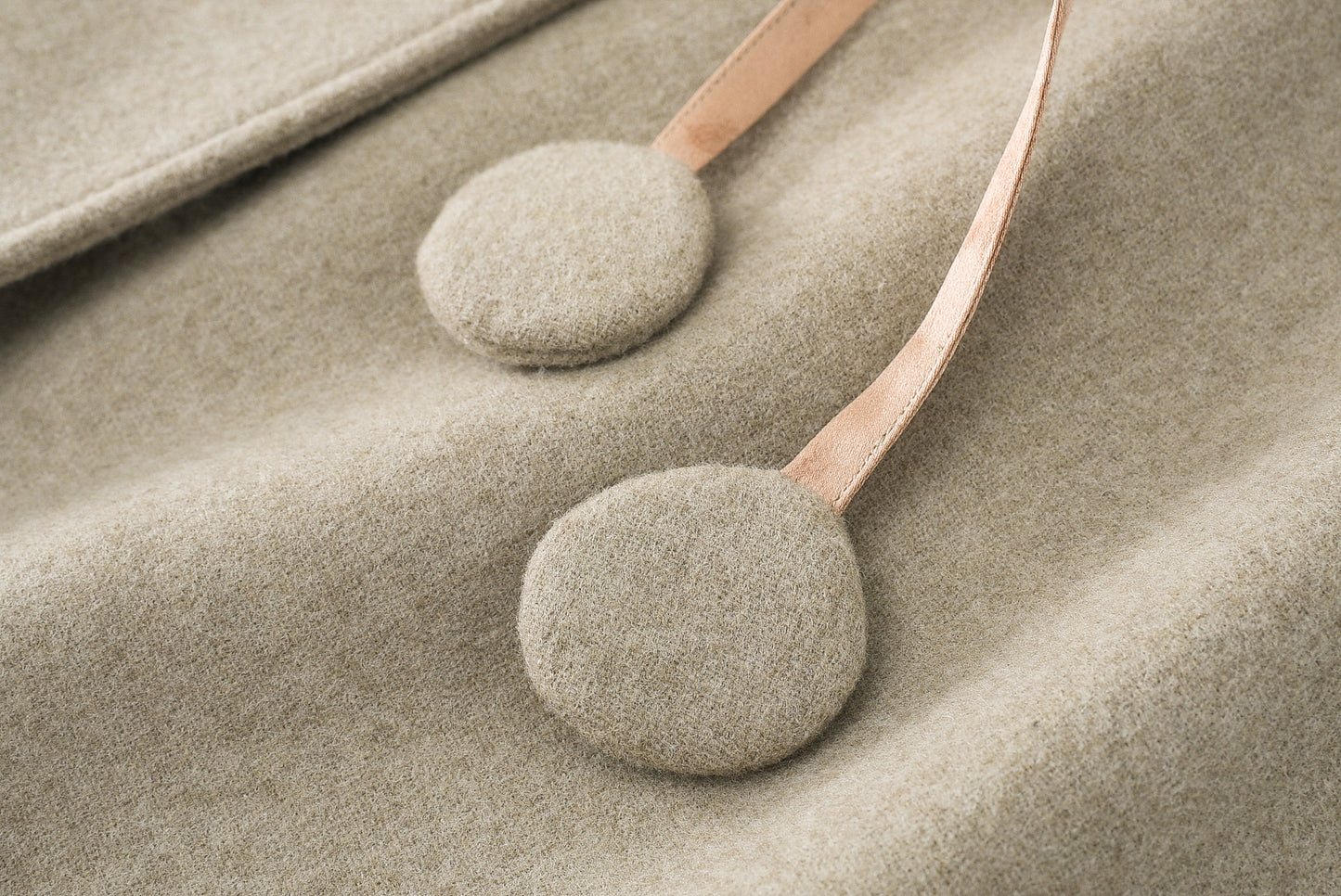 Loden poncho with silk details