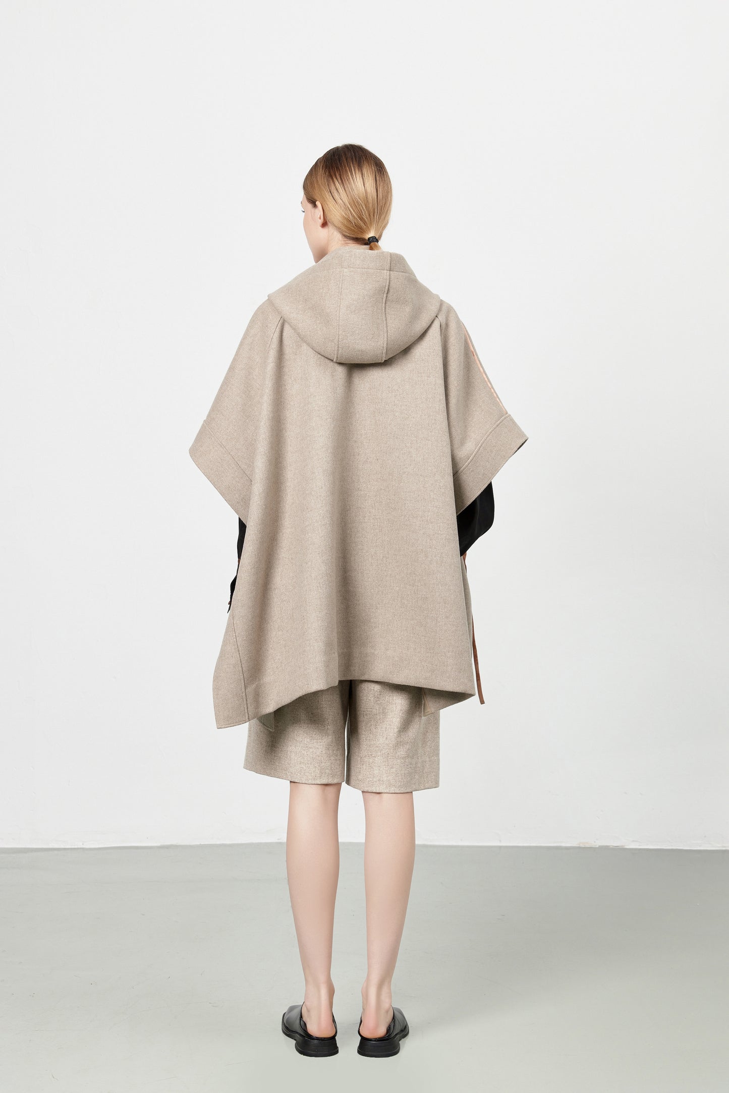 Loden poncho with silk details