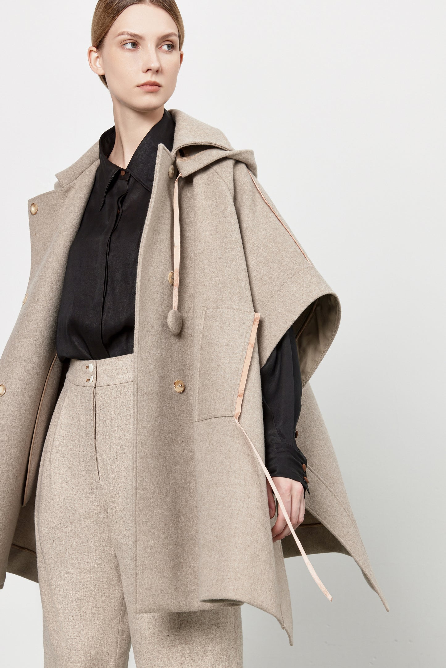 Loden poncho with silk details