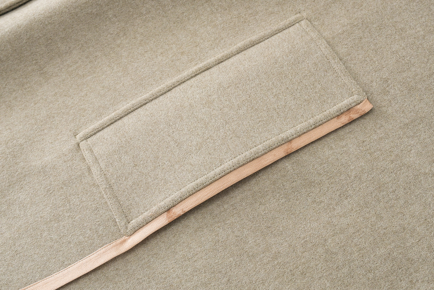 Loden poncho with silk details