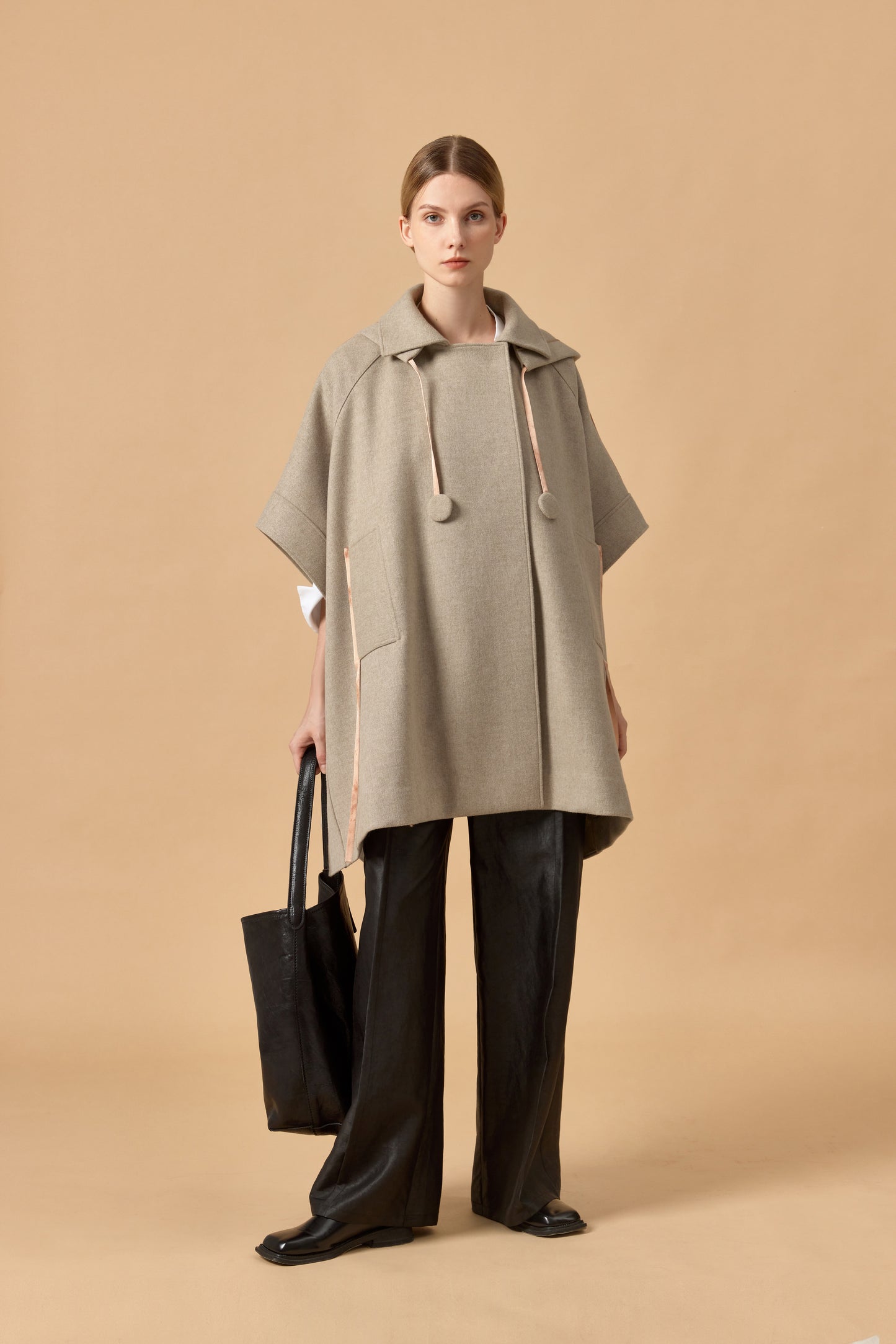 Loden poncho with silk details