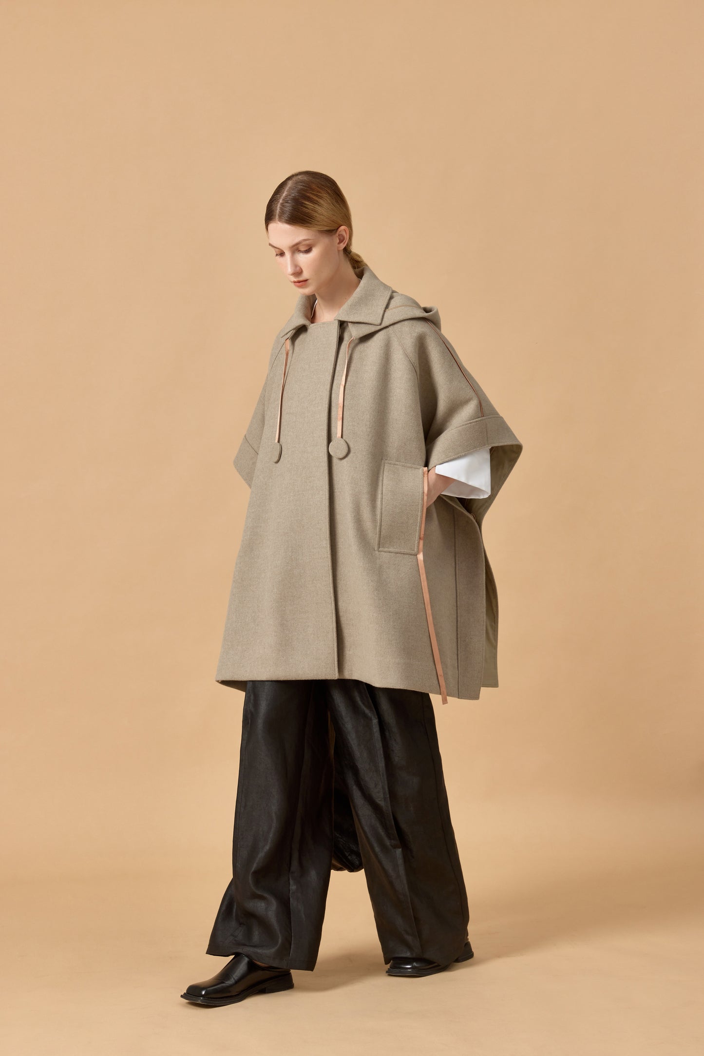 Loden poncho with silk details
