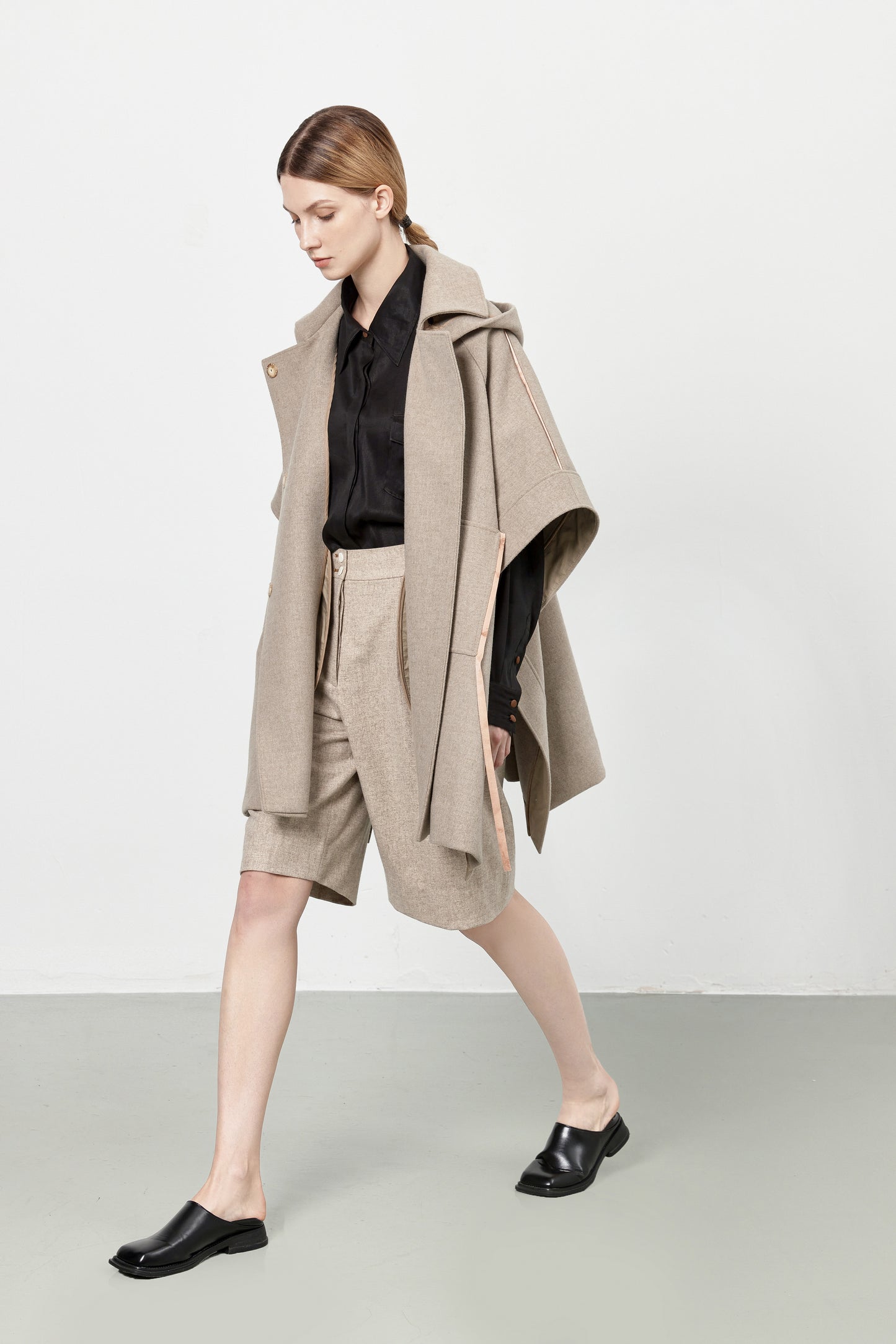 Loden poncho with silk details