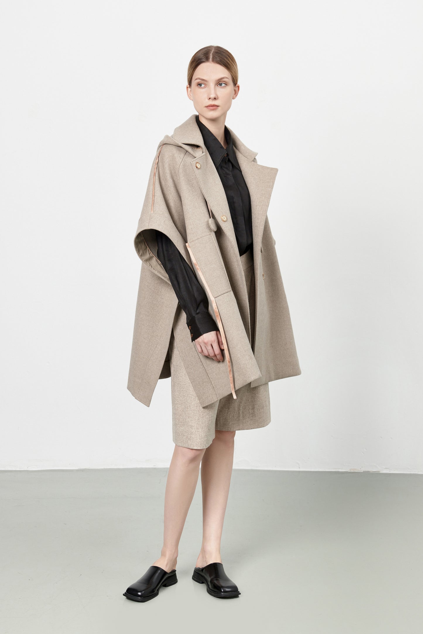 Loden poncho with silk details